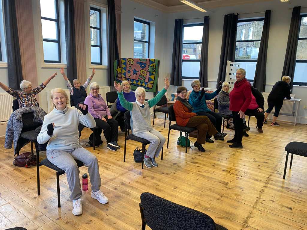 Fun and social community events, chair exercise class Stainland