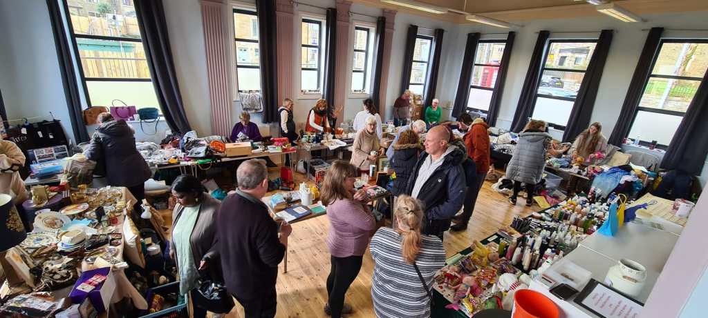 Customers browse tables at the table top sale at The Old Library